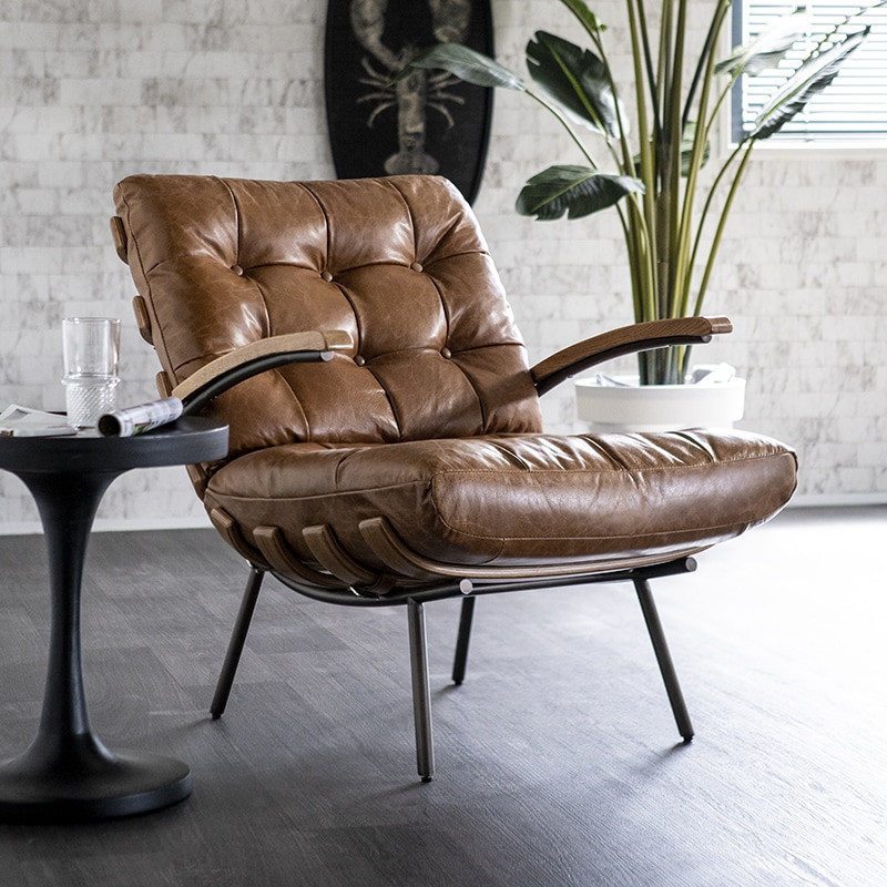 Fauteuil vintage cuir cognac et bois sur Design